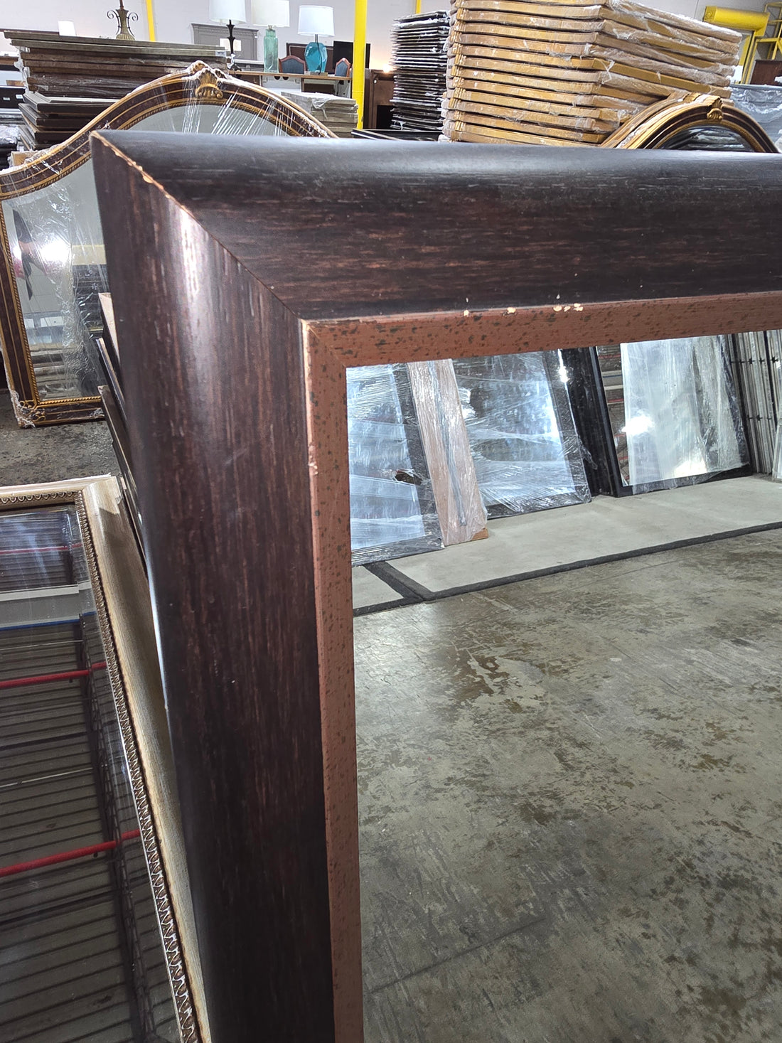 Decorative mirror with bronze inner trim detail 31 1/4 x 43 1/4