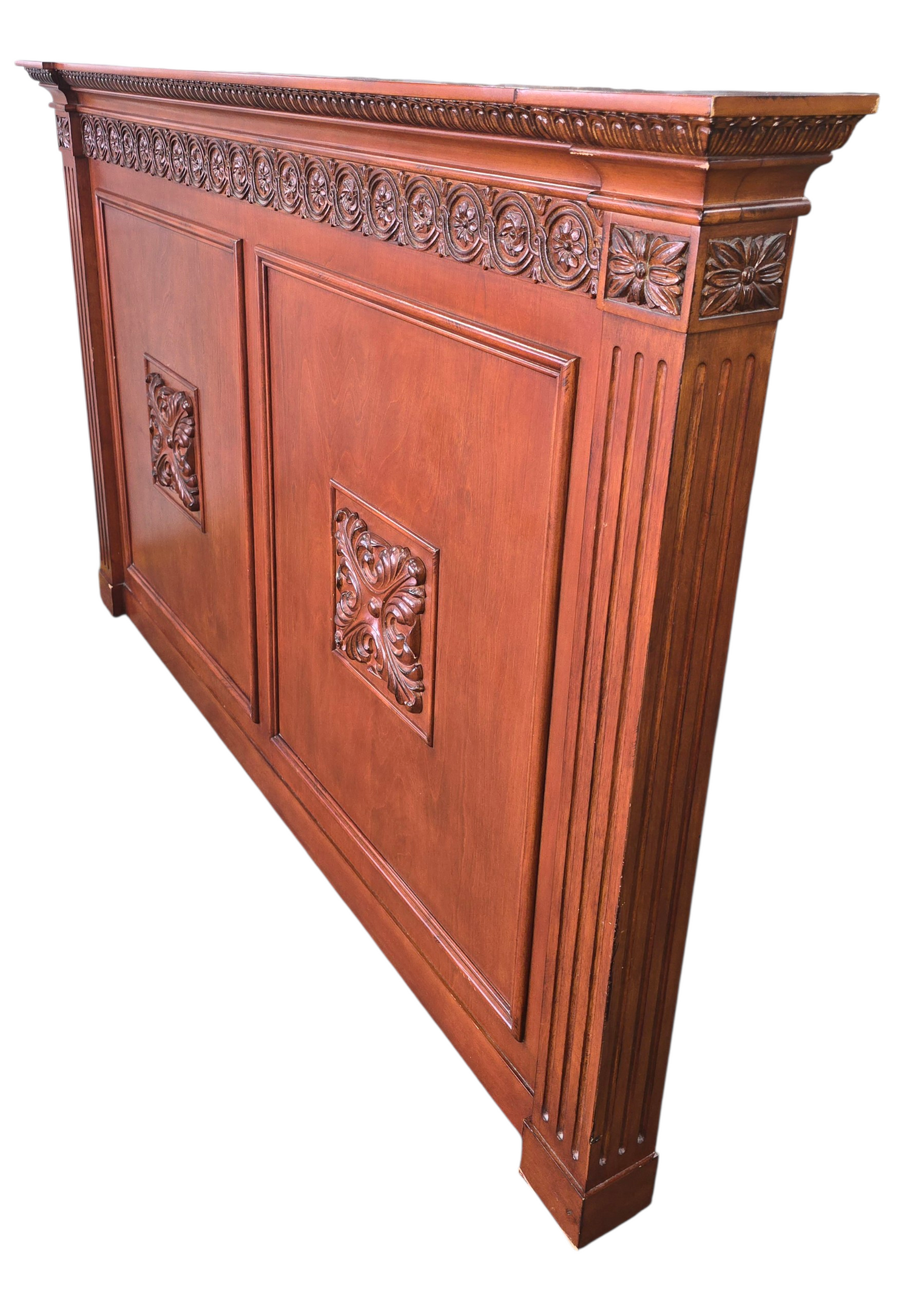 Side angle view showing thick profile of carved wood headboard