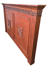 Side angle view showing thick profile of carved wood headboard