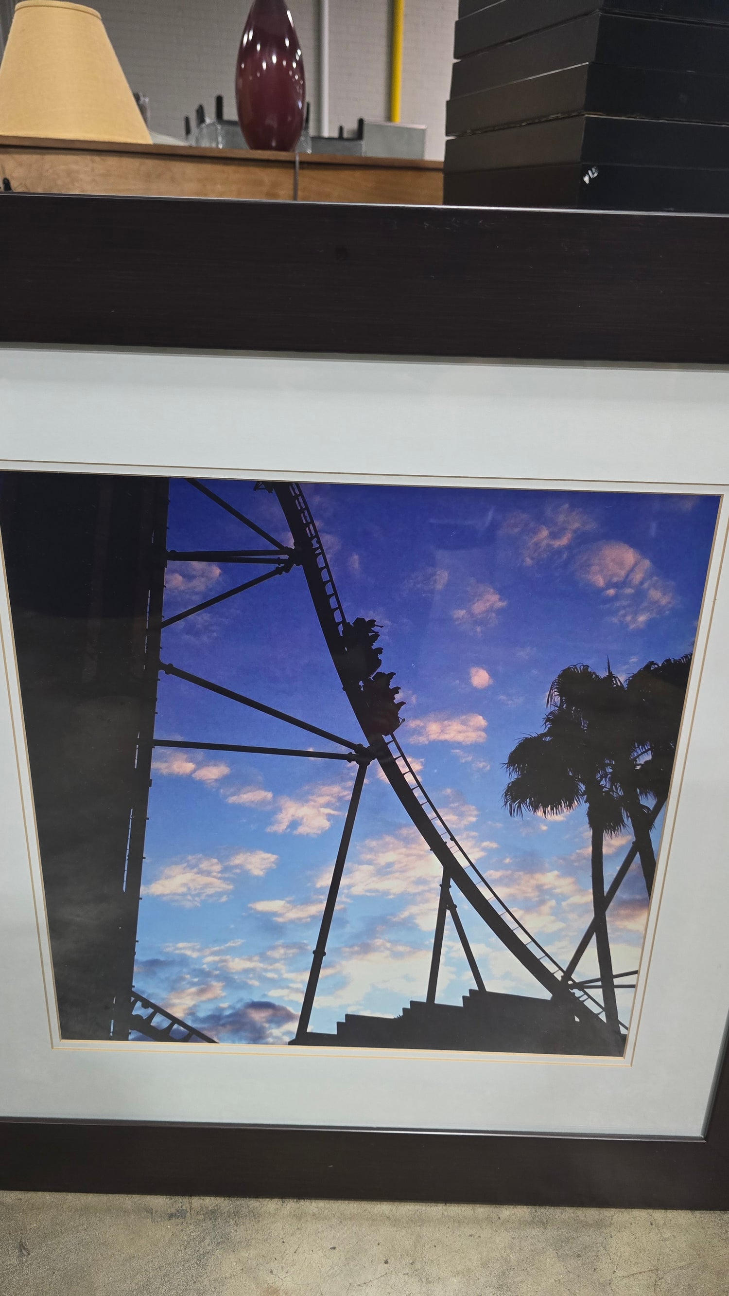 Close-up detail of people riding a roller coaster