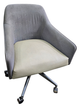 Rolling desk chair with gray fabric back and tan upholstered seat, used and in good condition