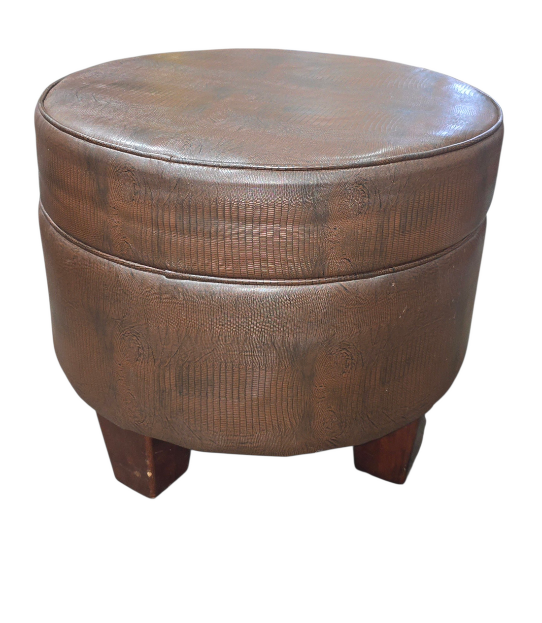 Front view of round brown vinyl ottoman
