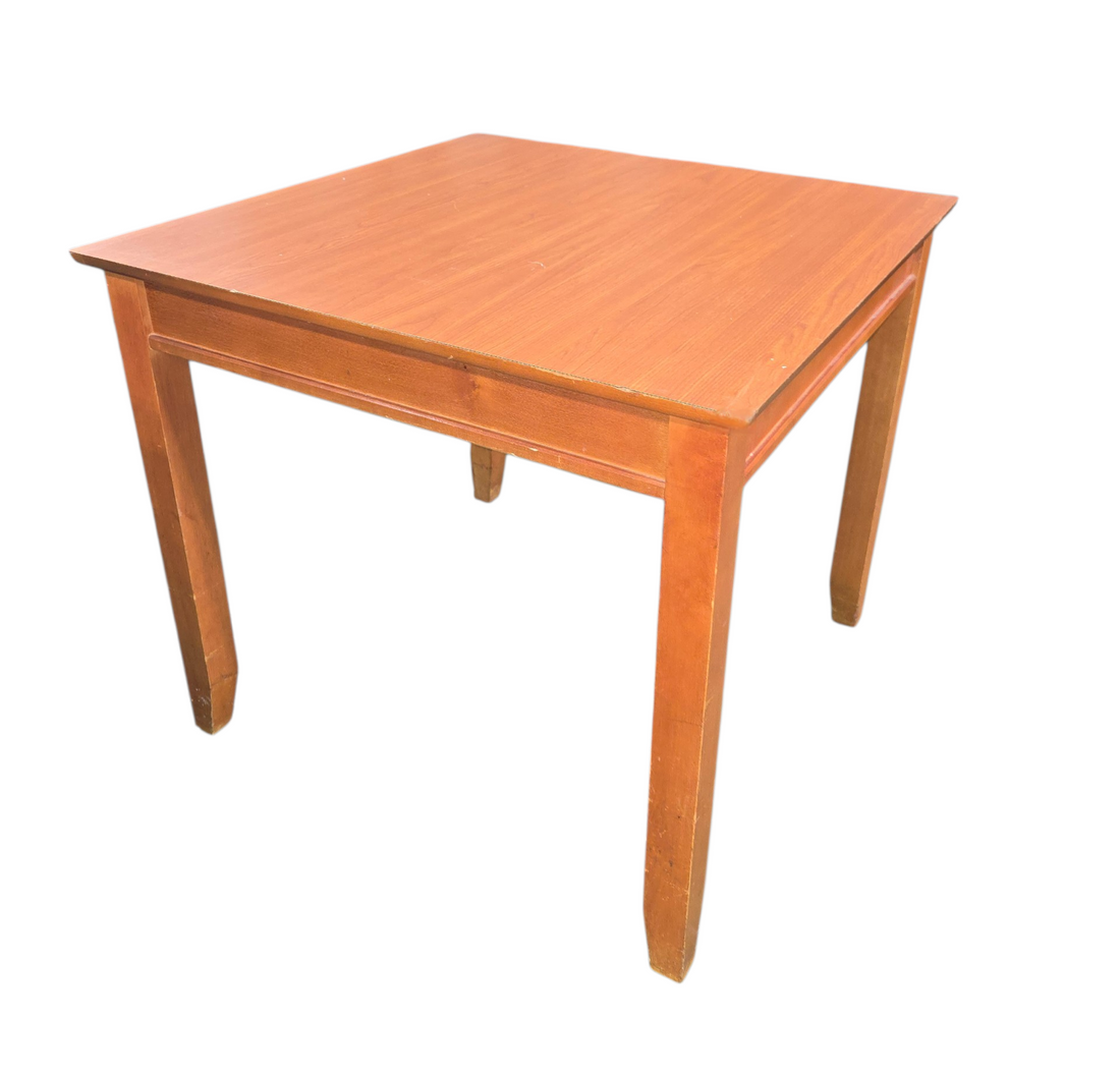 Simple wooden dining table with square top