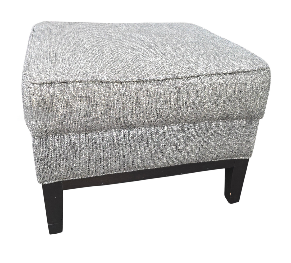 Small gray fabric footstool in good condition