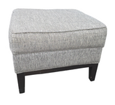 Small gray fabric footstool in good condition