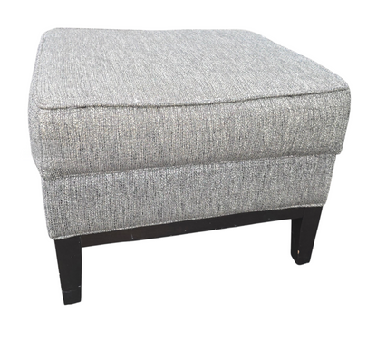 Small gray fabric footstool in good condition