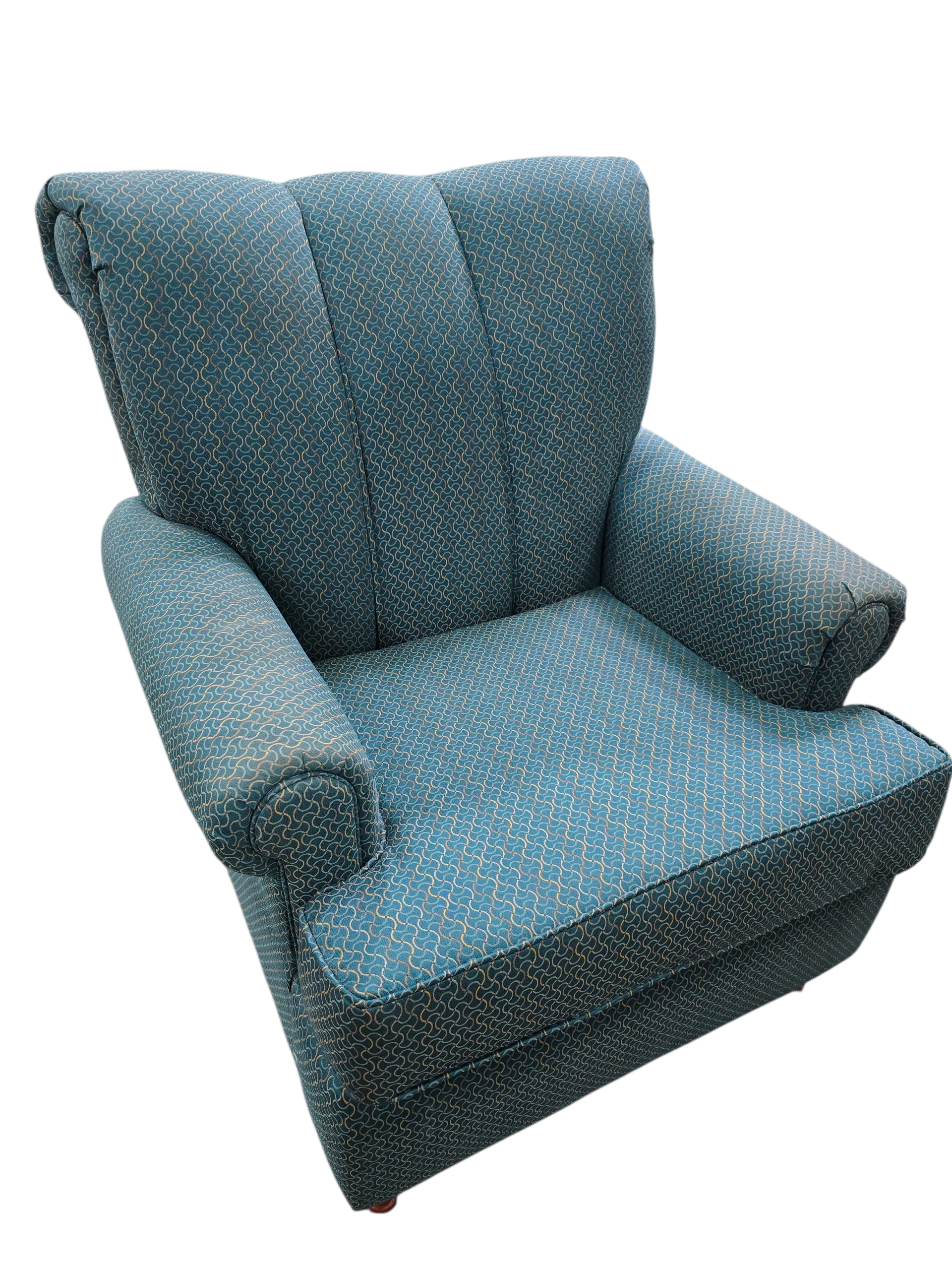 Teal upholstered accent chair with patterned fabric used in good condition