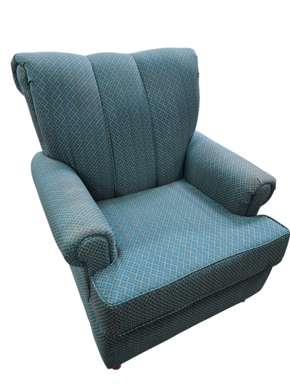 Teal upholstered accent chair with patterned fabric used in good condition