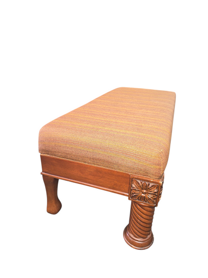Side angle view of upholstered seating bench
