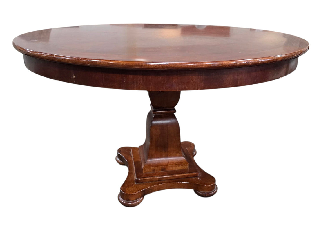 SHL side view of quality used 48 inch round wood pedestal dining table featuring a solid traditional pedestal base and cherry wood finish sourced from an upscale resort