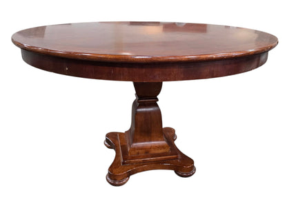 SHL side view of quality used 48 inch round wood pedestal dining table featuring a solid traditional pedestal base and cherry wood finish sourced from an upscale resort