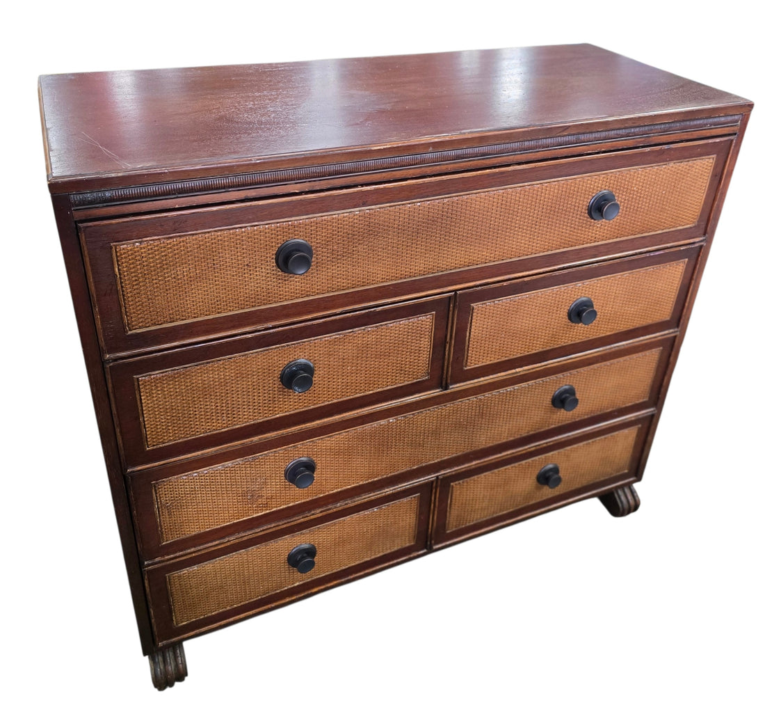 Angled front view of a quality used six drawer cane front dresser with wood frame and woven drawer fronts. Available in Cartersville, GA.