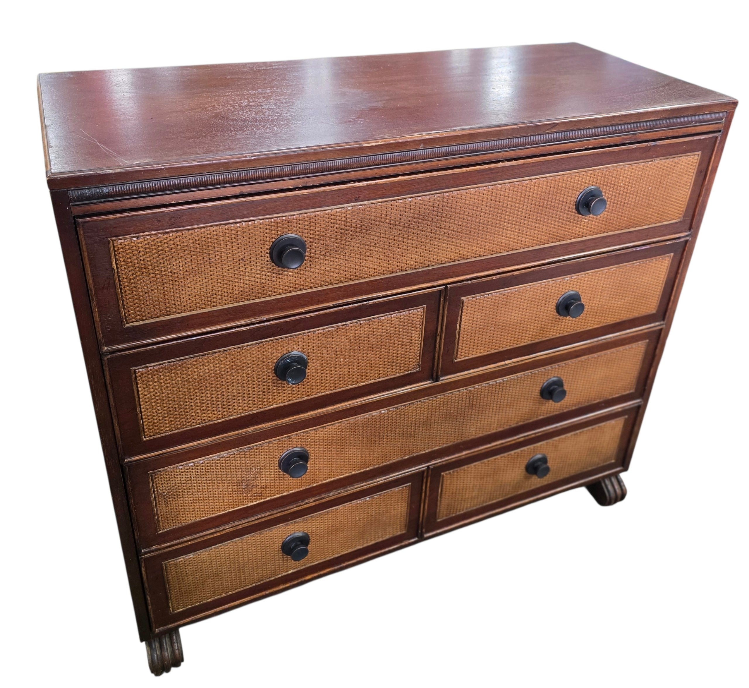 Angled front view of a quality used six drawer cane front dresser with wood frame and woven drawer fronts. Available in Cartersville, GA.