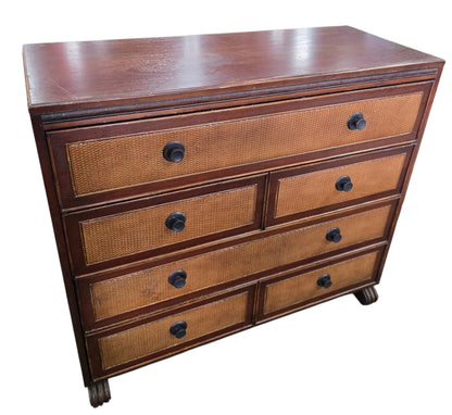 Angled front view of a quality used six drawer cane front dresser with wood frame and woven drawer fronts. Available in Cartersville, GA.