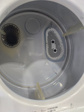 Used Whirlpool stacked washer dryer interior SHL