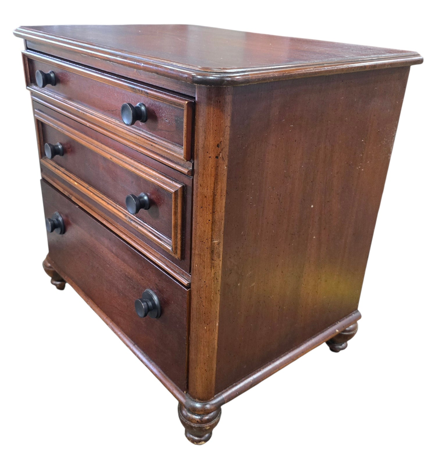 Angled view of a quality used American of Martinsville two drawer nightstand featuring a warm wood finish and turned feet. Available in Cartersville, GA.