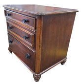 Angled view of a quality used American of Martinsville two drawer nightstand featuring a warm wood finish and turned feet. Available in Cartersville, GA.