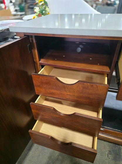 Interior of a used American of Martinsville mini fridge cabinet showing adjustable shelf and three storage drawers beneath the gray granite top. Available in Cartersville, GA.