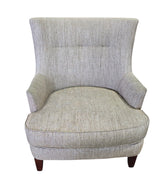 SHL used beige upholstered accent chair with textured woven fabric and tapered wood legs sourced from an upscale resort