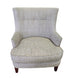 SHL used beige upholstered accent chair with textured woven fabric and tapered wood legs sourced from an upscale resort
