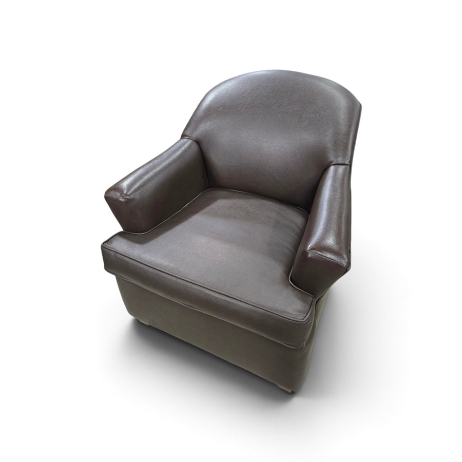 Used dark brown vinyl accent chair with padded arms, front view, SHL