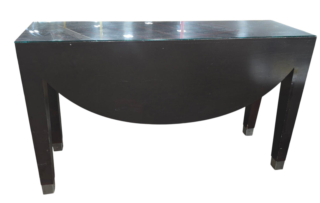 SHL used dark espresso sofa table with glass top and contemporary curved apron design sourced from an upscale resort