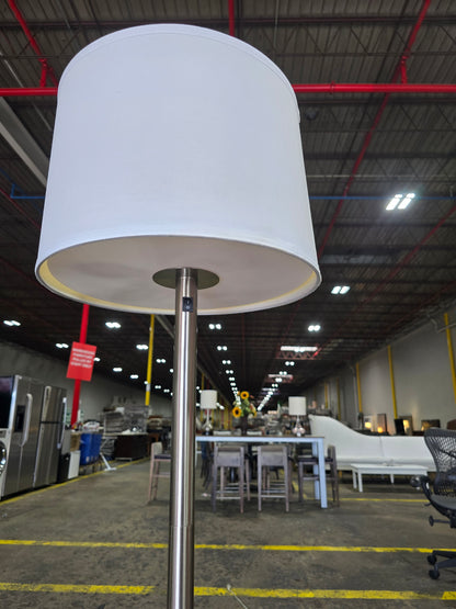 SHL quality used brushed nickel floor lamp showing white drum shade and metal pole sourced from an upscale resort