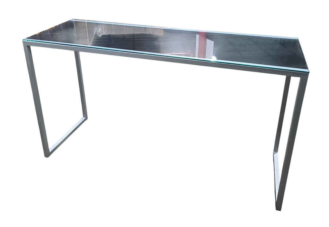 Used modern glass top sofa table with silver metal frame measuring 54 inches wide by 18 inches deep