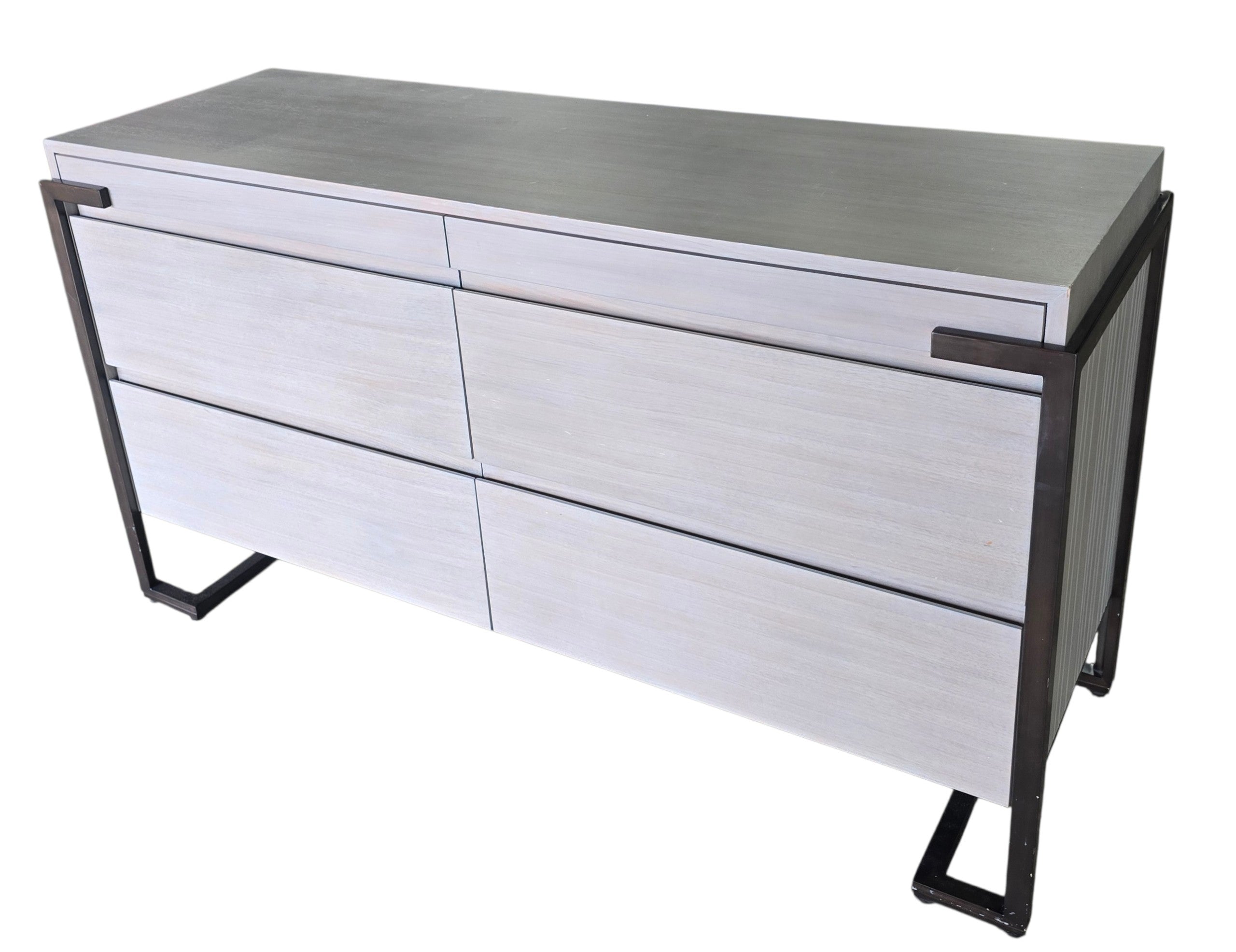 Angled view of a used Montague gray wood 4 drawer dresser with soft close drawers and metal frame from Southern Hospitality Liquidation in Cartersville, GA near Atlanta, Marietta, Kennesaw, and Rome.