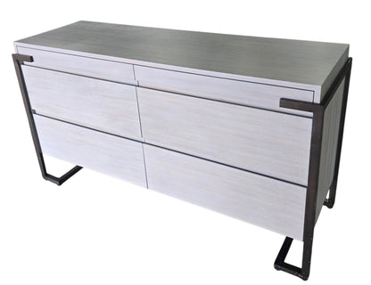 Angled view of a used Montague gray wood 4 drawer dresser with soft close drawers and metal frame from Southern Hospitality Liquidation in Cartersville, GA near Atlanta, Marietta, Kennesaw, and Rome.