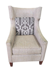 SHL used neutral beige wingback accent chair with gray geometric accent pillow sourced from upscale resort