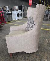 SHL used neutral beige wingback accent chair side profile showing wingback design and curved arms