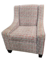 Used wingback accent chair with geometric patterned upholstery sourced from an upscale resort