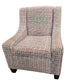 Used wingback accent chair with geometric patterned upholstery sourced from an upscale resort