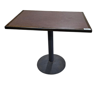 Used rectangular dark wood dining table with black pedestal base measuring 24 inches wide by 36 inches deep