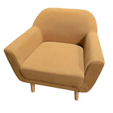Used sandstone bouclé accent chair with curved back and natural wood legs sourced from an upscale resort