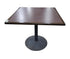 Used square dark wood dining table with black pedestal base measuring 36 inches wide by 36 inches deep