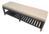 Angled view of a quality used upholstered storage bench with a cream upholstered seat and slatted lower shelf, sourced from an upscale resort. Available at Southern Hospitality Liquidation in Cartersville, GA.