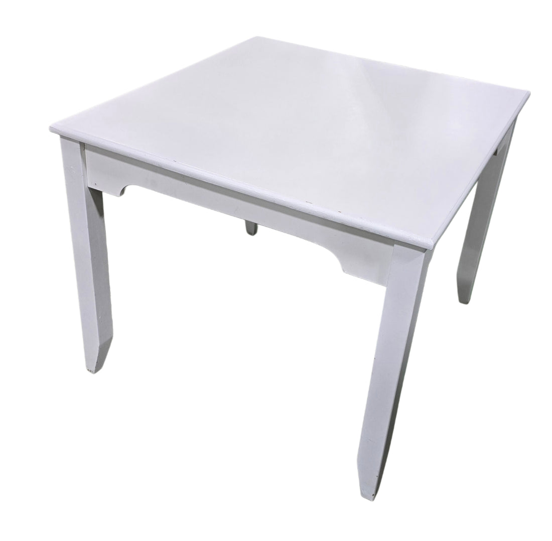 SHL angled view of compact white dining table measuring 36 x 38 x 30