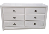 Front view of white dresser with shell shaped drawer pulls