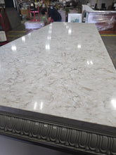 Close-up of white granite top surface on TV dresser