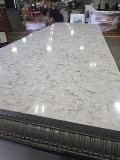 Close-up of white granite top surface on TV dresser