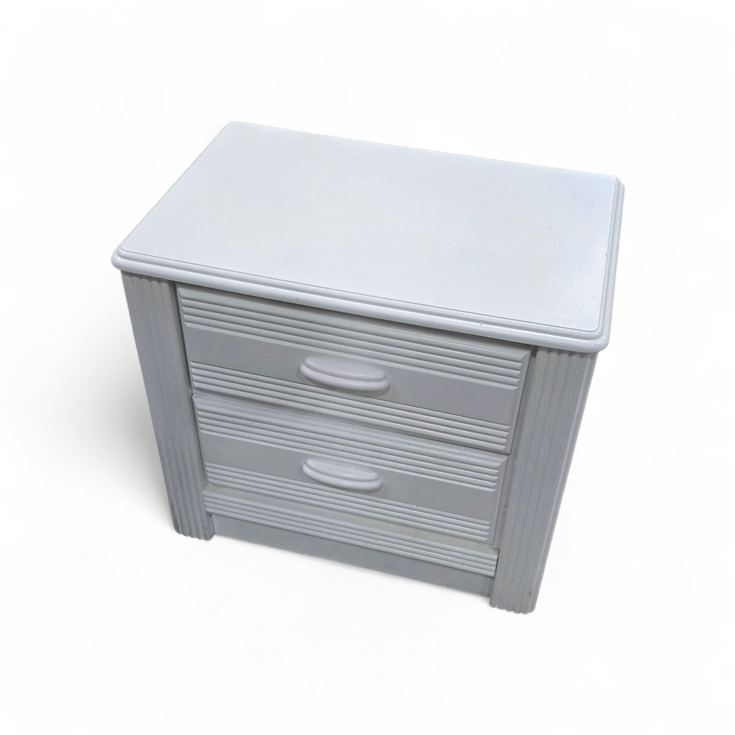 SHL angled view of white reeded nightstand for bedside storage, used and in good condition