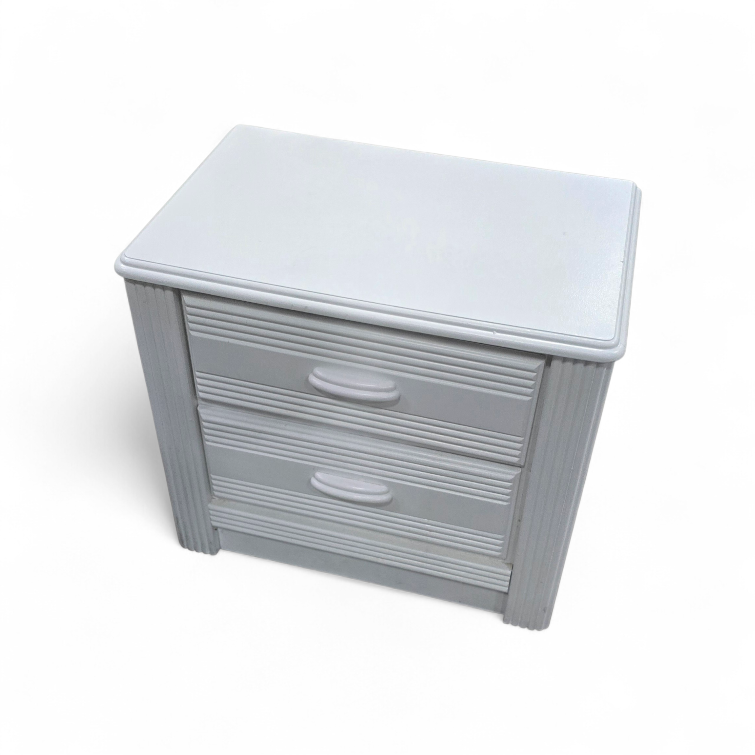 SHL angled view of white reeded nightstand for bedside storage, used and in good condition