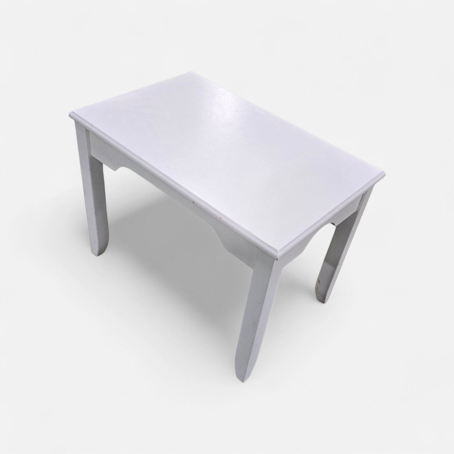 SHL close-up of top surface on white side table, used and in good condition