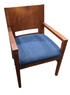 Front view of wood dining arm chair with blue fabric seat