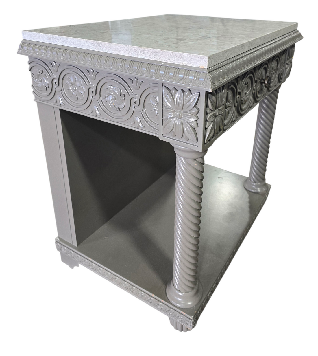 Side angle view showing carved detailing on nightstand