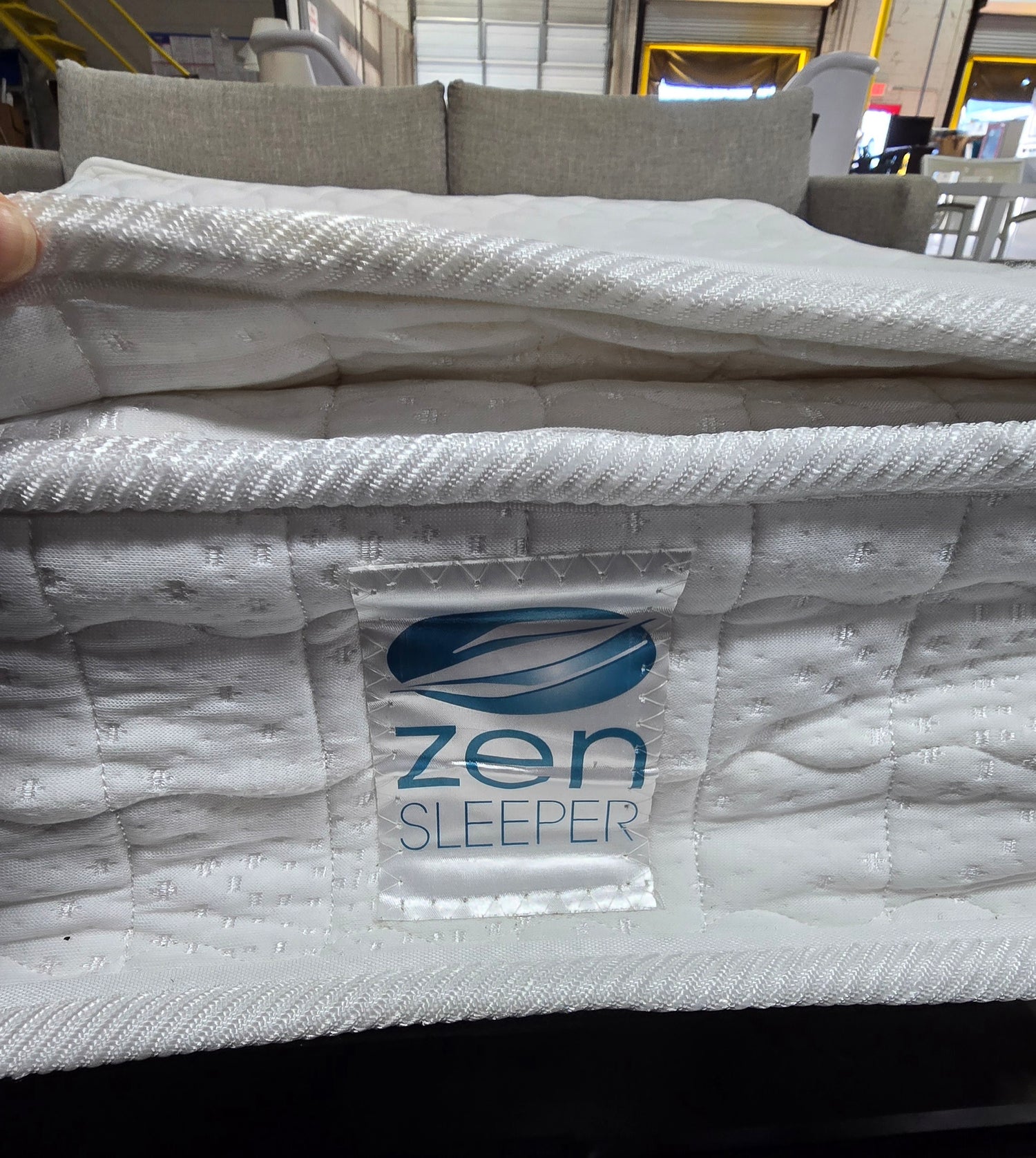 SHL close-up of Zen brand pillow top mattress inside Kellex sleeper sofa
