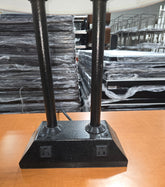 SHL close up of black table lamp base with built in electrical outlets and dual column design