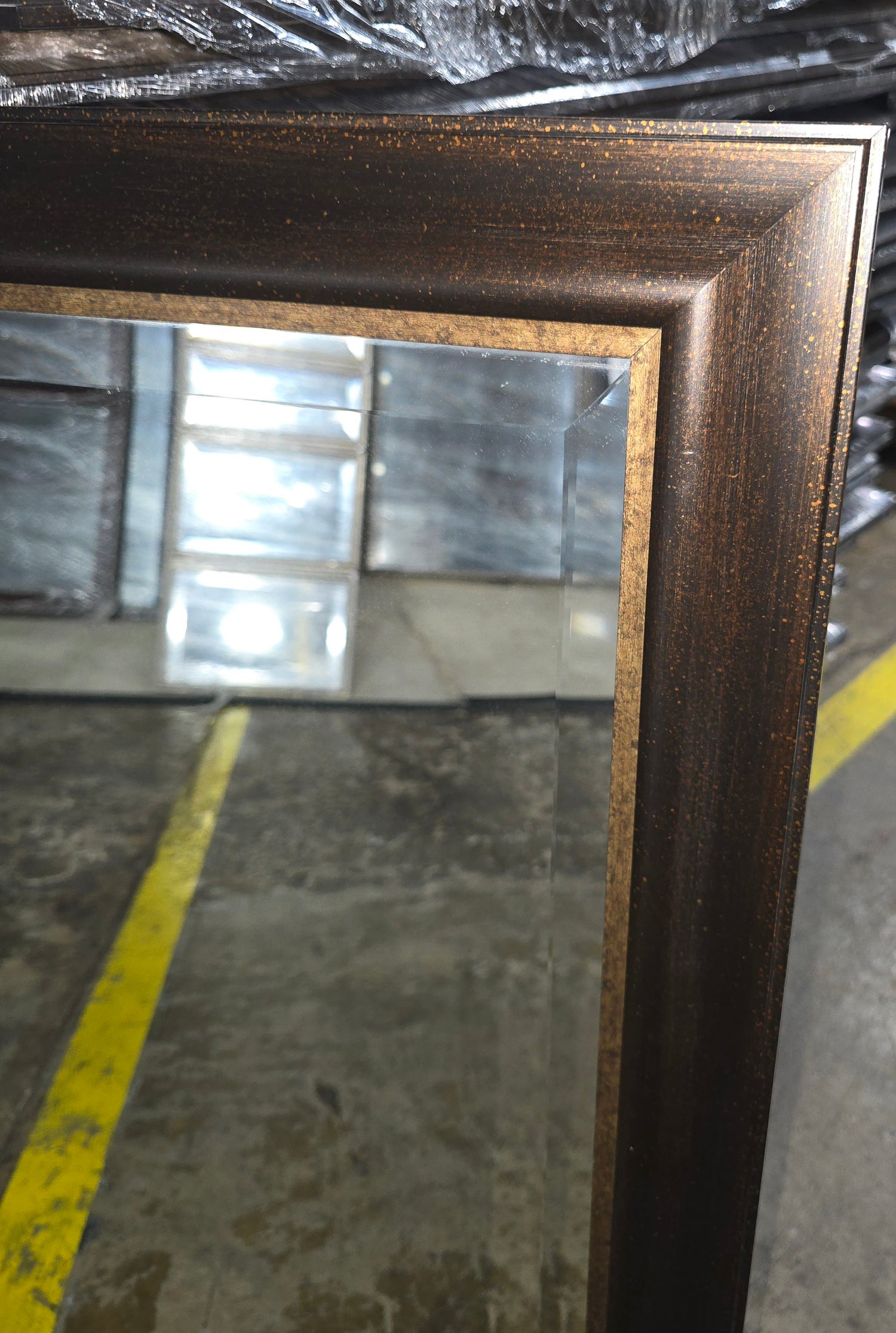 SHL dark wood framed wall mirror 31.5 x 39.5 angled view with bronze accent trim used in good condition